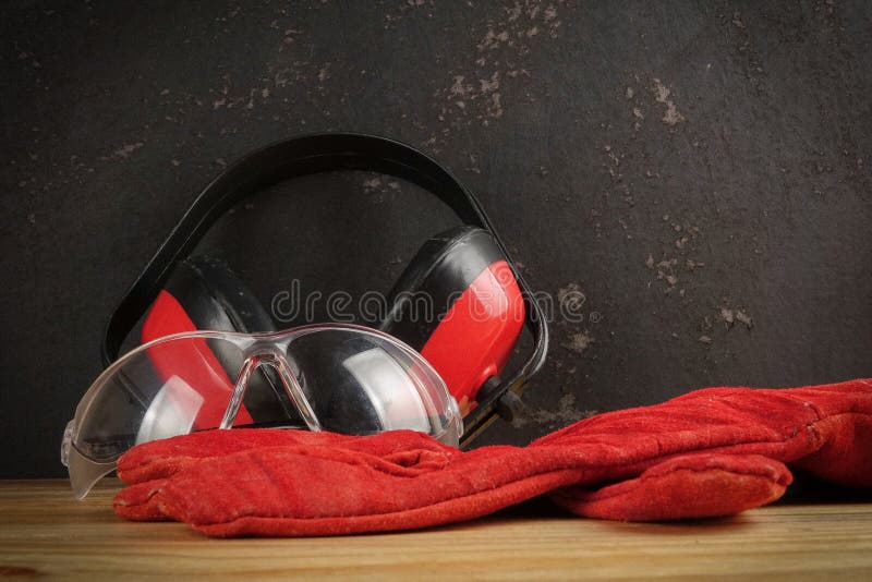 Safety Personal Protective EquipmentPPE on a rustic black background. stock images