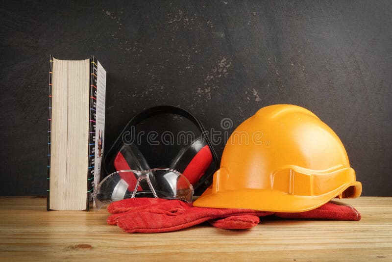 Safety Personal Protective EquipmentPPE on a rustic black background. stock photos