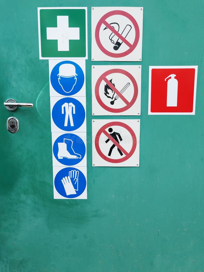 Safety Signs on a Green Door for Warning Stock Photo Image of