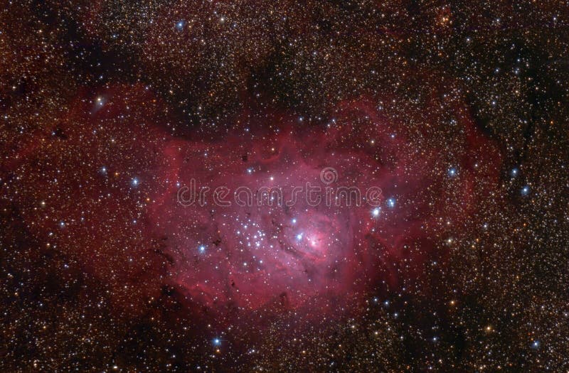 Lagoon (M8) nebula in Sagittarius constellation. Huge hydrogen clouds in the Milky Way, young star forming region. Lagoon (M8) nebula in Sagittarius constellation. Huge hydrogen clouds in the Milky Way, young star forming region.