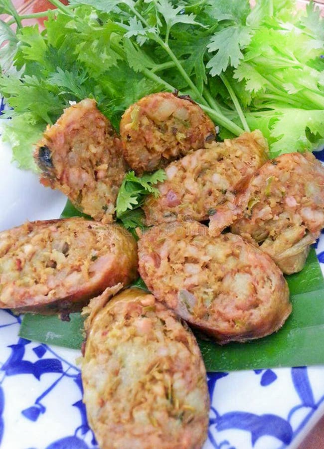 SAI AUA, Delicious tasty Golden NOTRHERN THAI SPICY SAUSAGE is a type of smoked roast with sticky rice. royalty free stock photography SAI AUA, Delicious tasty Golden NOTRHERN THAI SPICY SAUSAGE is a type of smoked roast with sticky rice. royalty free stock photography