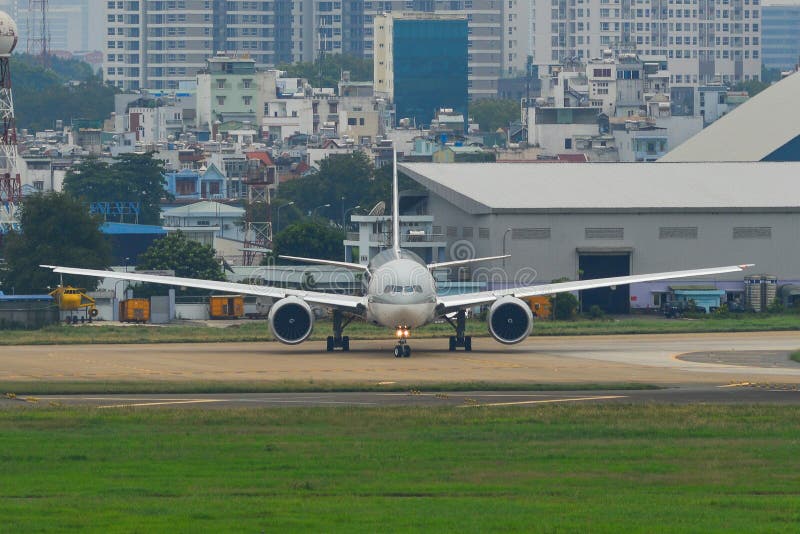 Passenger airplanes taxiing on runway stock image Passenger airplanes taxiing on runway stock image