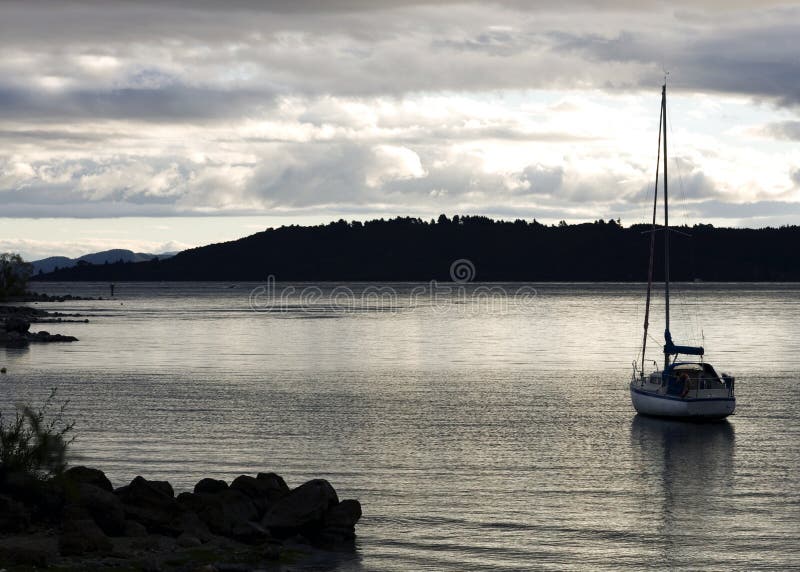 Sail Boat in Water at Dusk