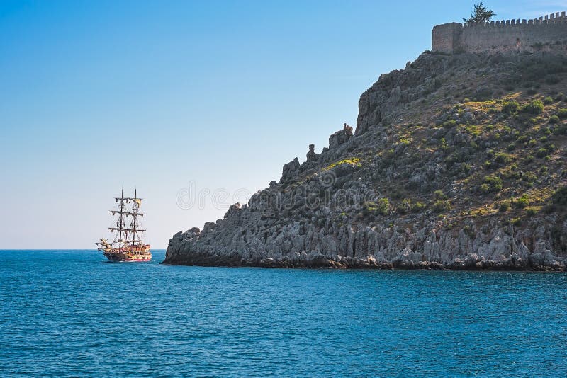 Sail ship and ancient fortress