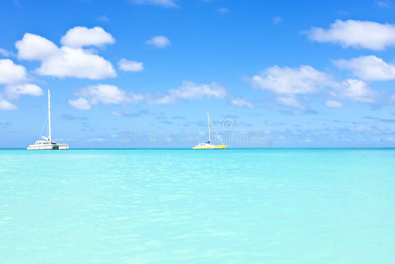 Sail yachts in a blue caribean sea stock images