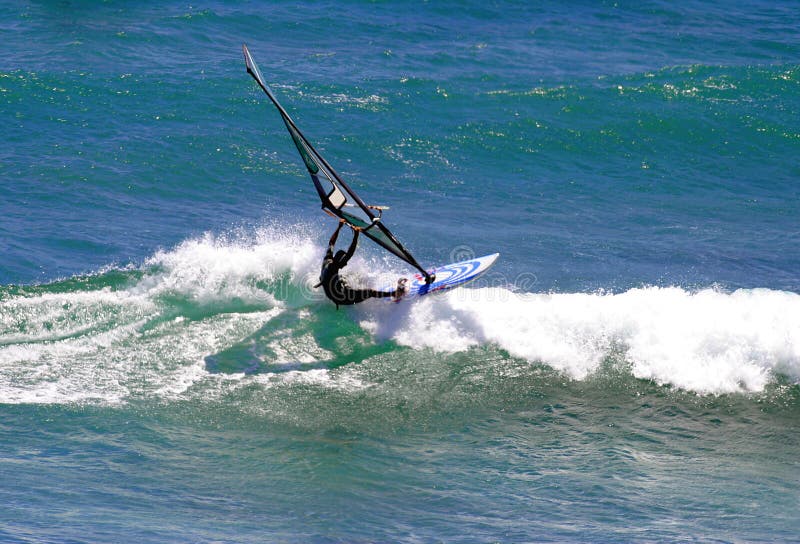 Sailboarder Windsurfing a Wave in Hawaii