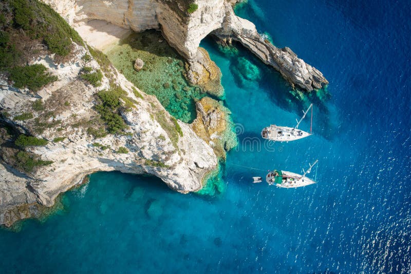 Sailboats in a beautiful bay, Paxos island, Greece..