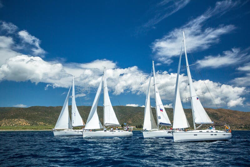 Sailboats participate in sailing regatta 12th Ellada Autumn 2014 among Greek island group in the Aegean Sea
