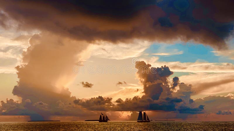 Sailboats on sea at sunset