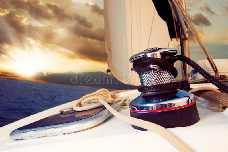 Yacht Sailing against sunset. Sailboat. Travel