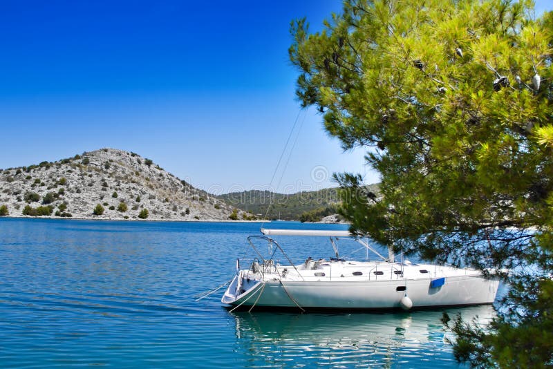 Sailing boat in Croatian bay stock photo