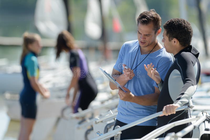 Sailing Coach Talking To Sailer Stock Image Image of beautiful