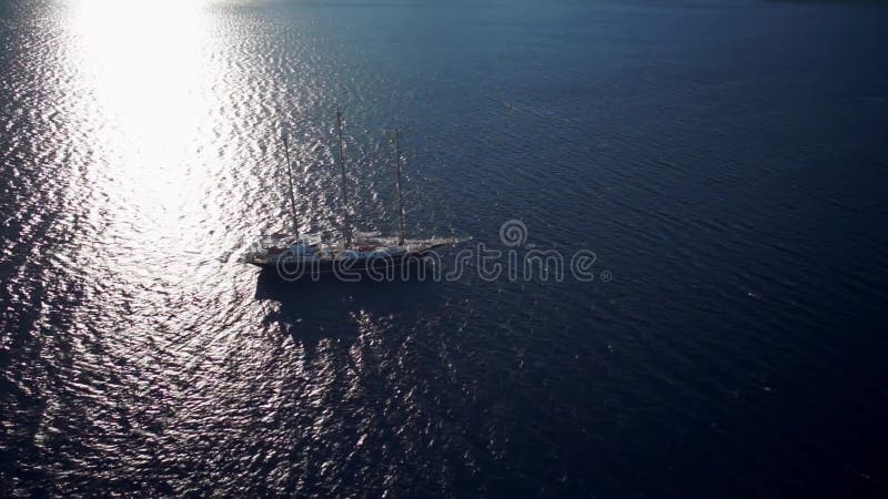 Sailing ship in calm weather sailing on the ocean