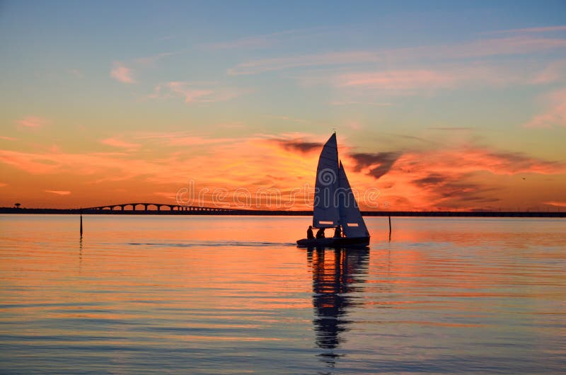 Sailing at sunset royalty free stock photo