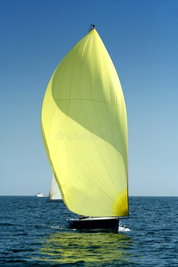 Sailing yacht with spinnaker in the wind