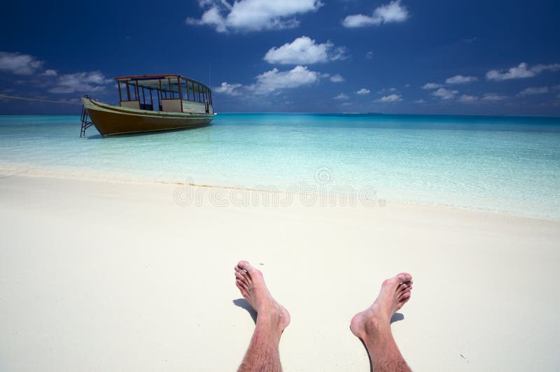 Sailor has a rest on a beach