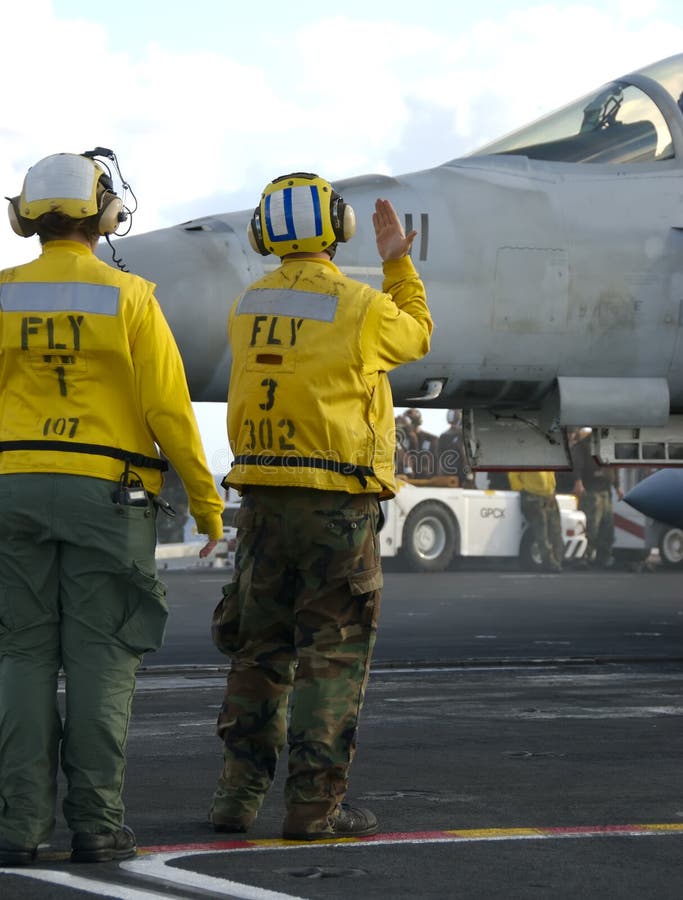 Sailors at work on flight deck