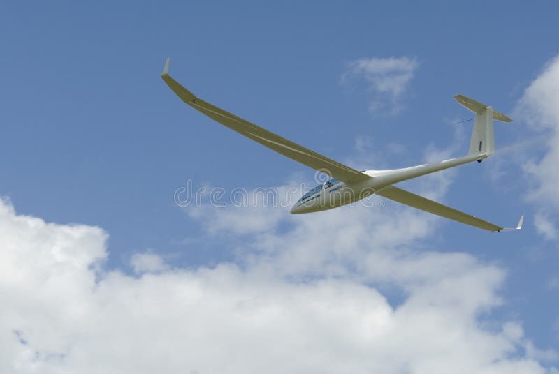 Sailplane gliding through the sky.