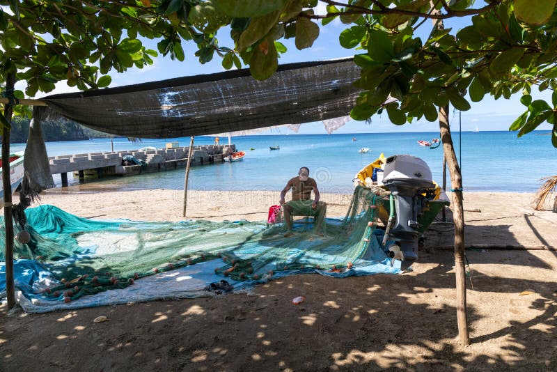 Fisherman at Anse La Raye beach