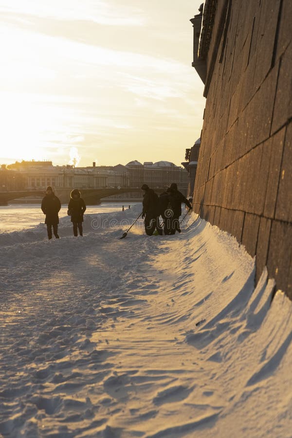 Cadets with shovels remove snow near the walls of the Peter and Paul fortress royalty free stock images