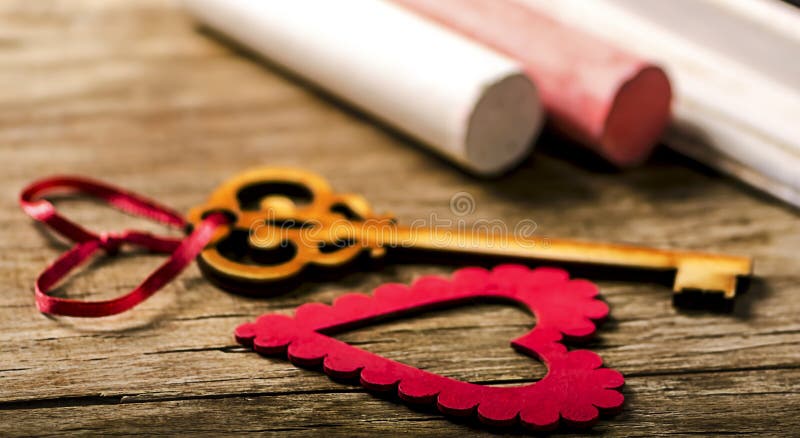 Saint Valentines decoration: heart and key, black board and chalk.