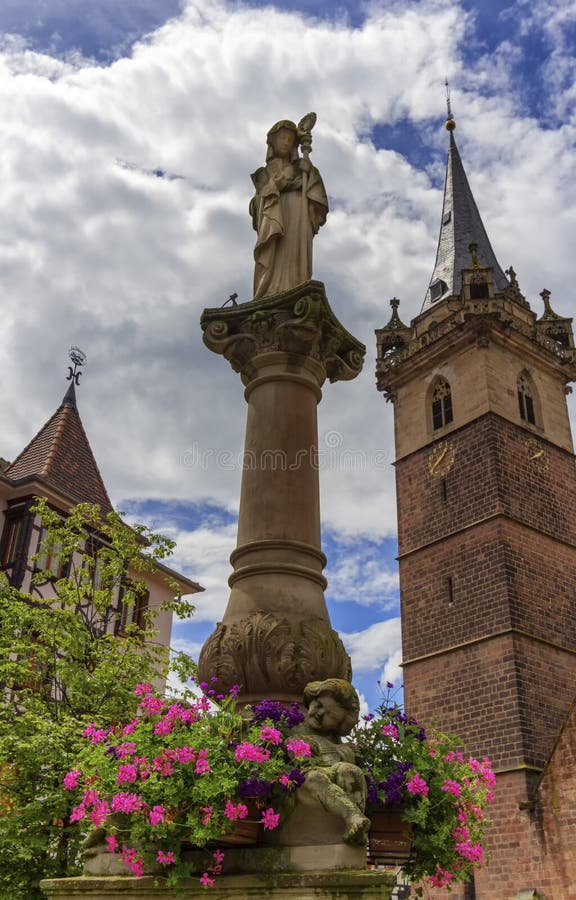 Sainte-Odile fountain and Kappelturm in Obernai village, Alsace