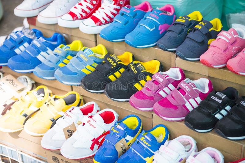 SAKAEO, THAILAND - MAY 21, 2016 : various sneaker in shop at Ron stock photo SAKAEO, THAILAND - MAY 21, 2016 : various sneaker in shop at Ron stock photo