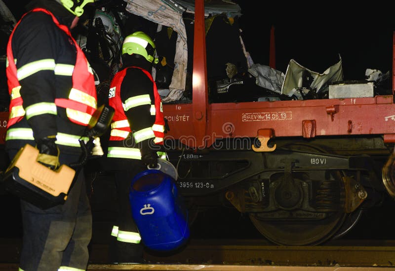 SAKVICE, THE CZECH REPUBLIC - JANUARY 14, 2018: The crashed car is transported away. Real car crash with train. The woman driver is dead. The firefighters cleaning up the railway line.