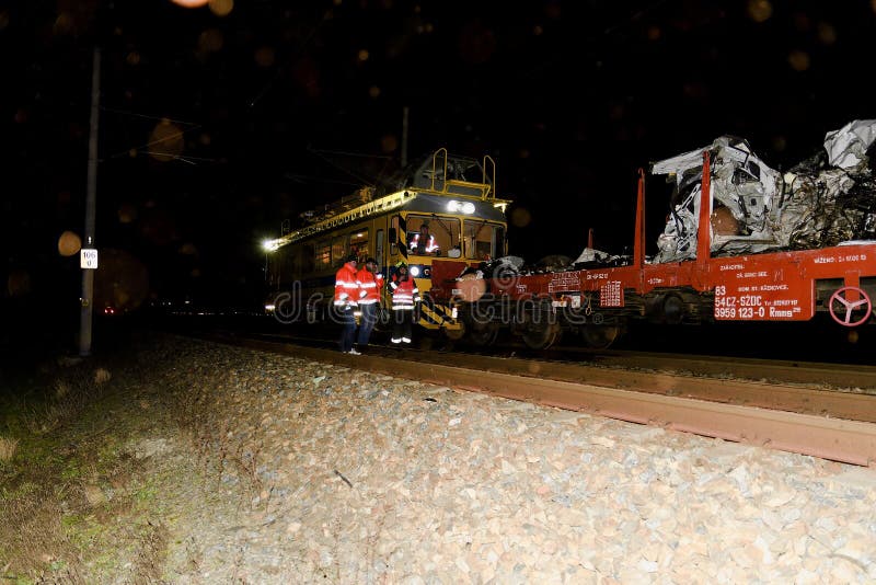 SAKVICE, THE CZECH REPUBLIC - JANUARY 14, 2018: The crashed car is transported away. Real car crash with train. The woman driver is dead. The firefighters finished cleaning up the railway line.