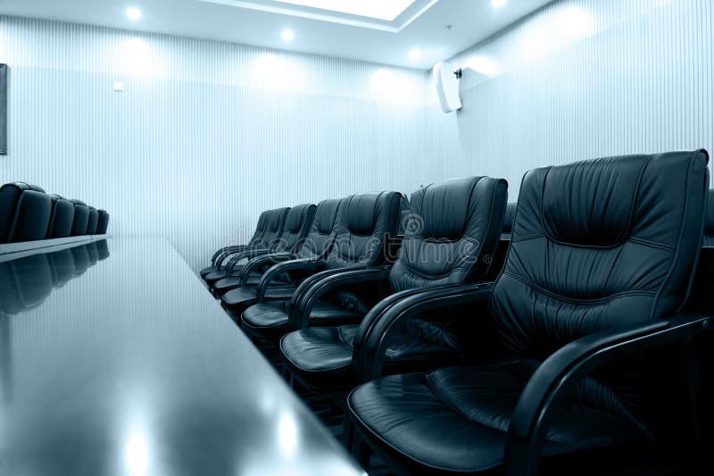 Head office boardroom with leather chairs, blue tone. Head office boardroom with leather chairs, blue tone.