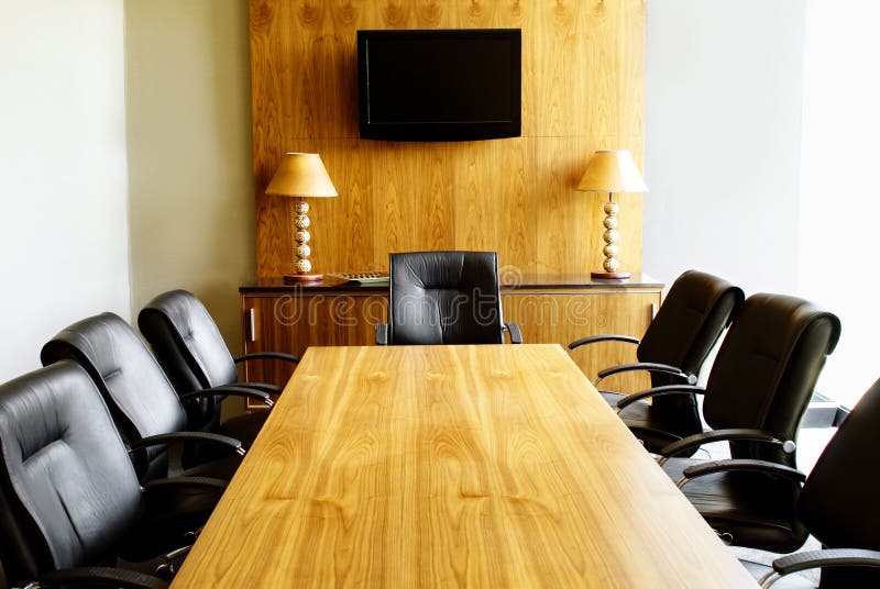 Modern Boardroom with Wooden Table, Black Leather Chairs and African Decor. Modern Boardroom with Wooden Table, Black Leather Chairs and African Decor