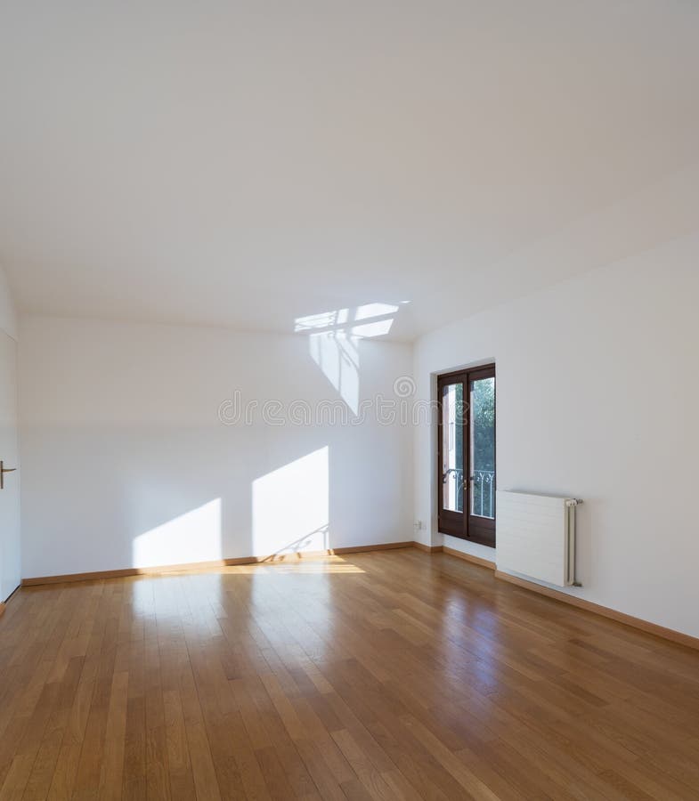 Sala nova completamente vazia com assoalhos de madeira fotos de stock