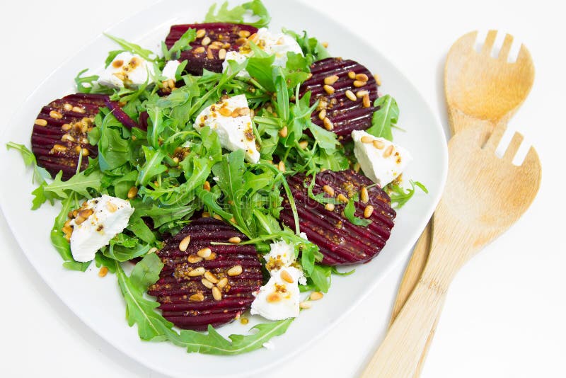 Salad of Baked Beet, Homemade Goat Cheese, Arugula and Pine Nuts Stock