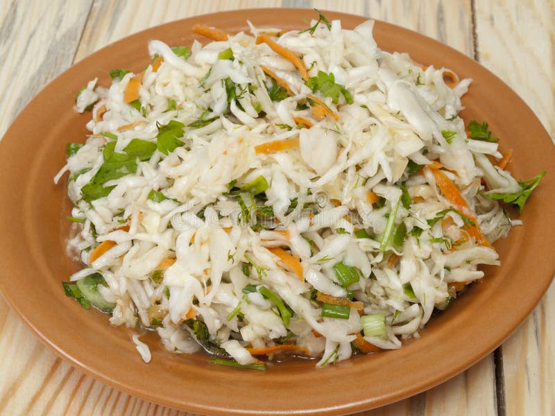 Plate full of salad from cabbage on a table from a tree. Addition salad stock images, royalty-free photos and pictures