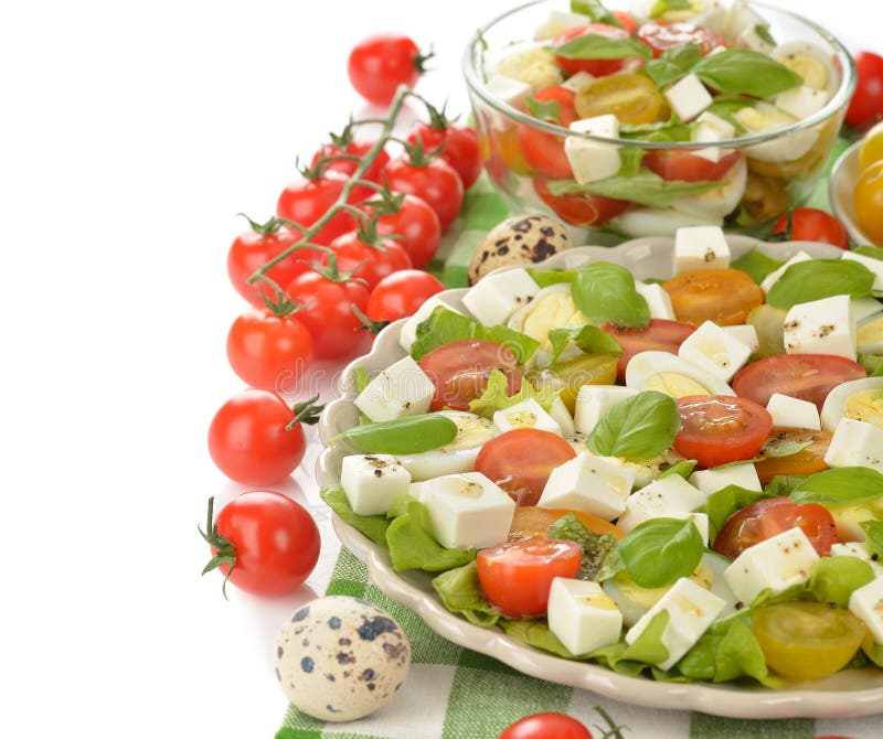 Salad with cherry tomatoes, eggs and cheese. Dietetic, assortment.