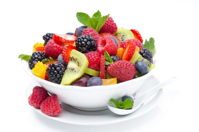 Salad of fresh fruit and berries in a bowl isolated, close-up