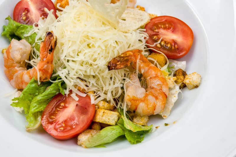 salad of fried shrimp, cherry tomatoes, croutons, cheese and fresh herbs