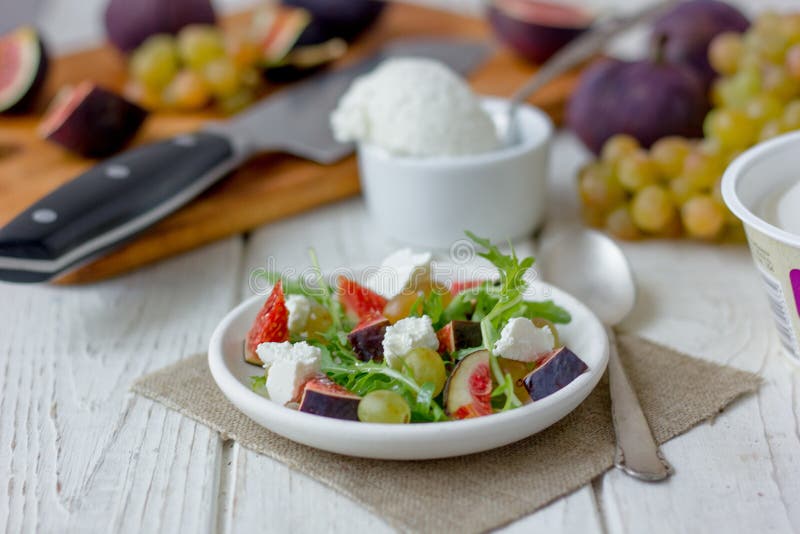 Salad with goat chees, arugula and figs. royalty free stock photos Salad with goat chees, arugula and figs. royalty free stock photos