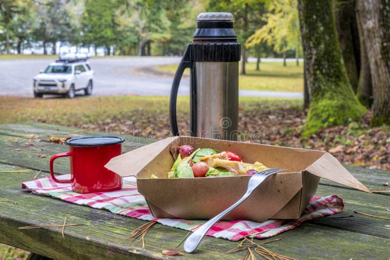 small steel thermos bottle and hot tea on a rock during cold season hiking  Stock Photo - Alamy