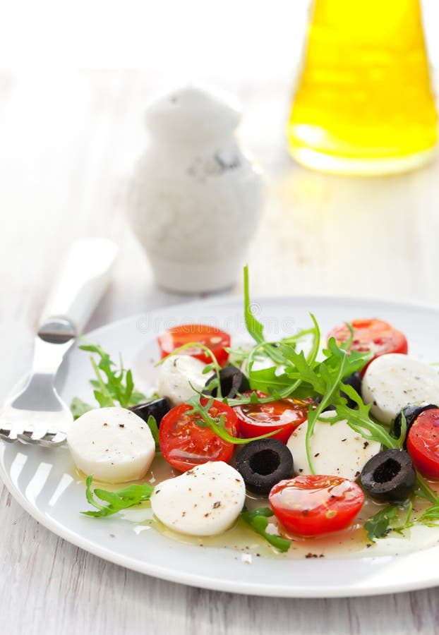 Salad with Mozzarella, Tomatoes and Black Olive Stock Image Image of