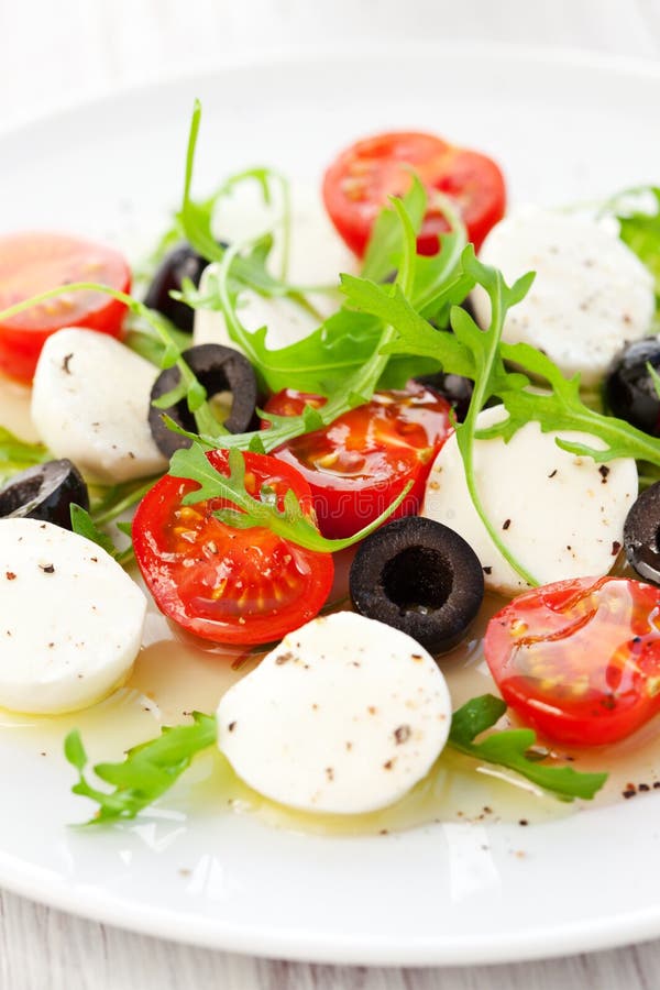 Salad with Mozzarella, Tomatoes and Black Olive Stock Image Image of