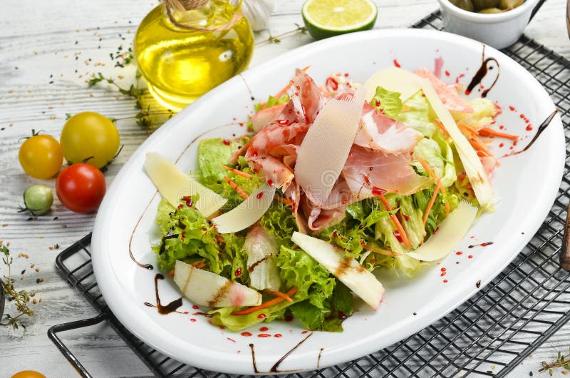 Salad with Prosciutto, Cheese, Pear and Herbs. Stock Photo Image of