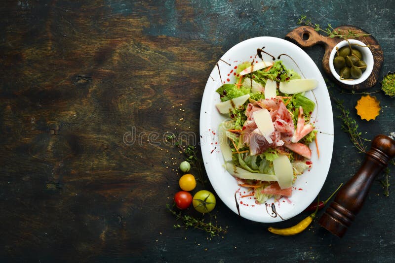 Salad with Prosciutto, Cheese, Pear and Herbs. Stock Photo Image of