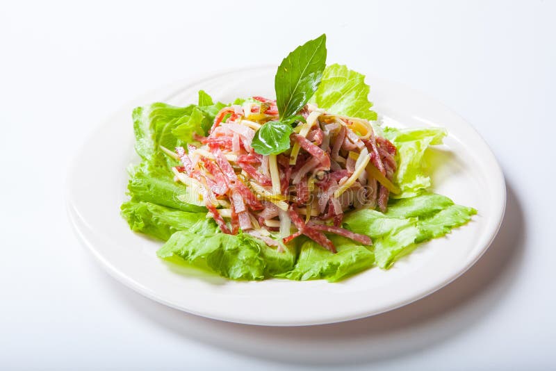 Salad from a Salami, Ham and Cheese on a White Plate Stock Photo