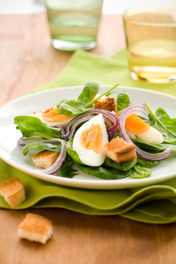 Salad with spinach, eggs stock photo. Image of plate 13199884