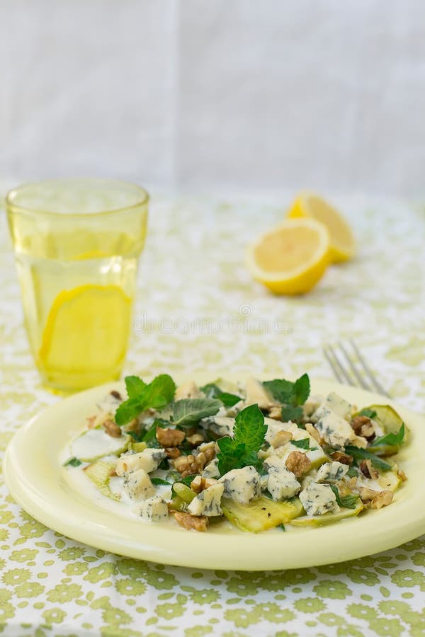 Salad with Squash, Blue Cheese, Walnuts and Yogurt Dressing Stock Image