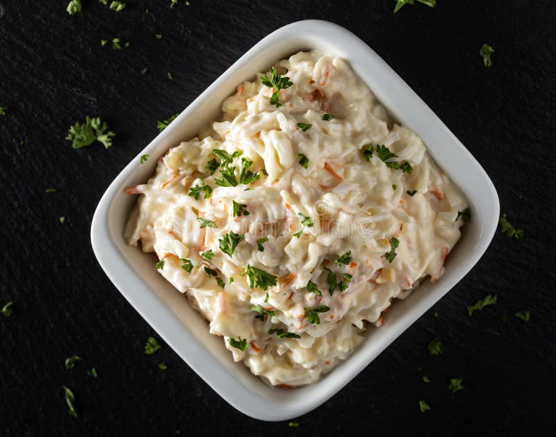 Salad of Surimi and Tomatoes with Eggs on Light Board Top Stock Photo