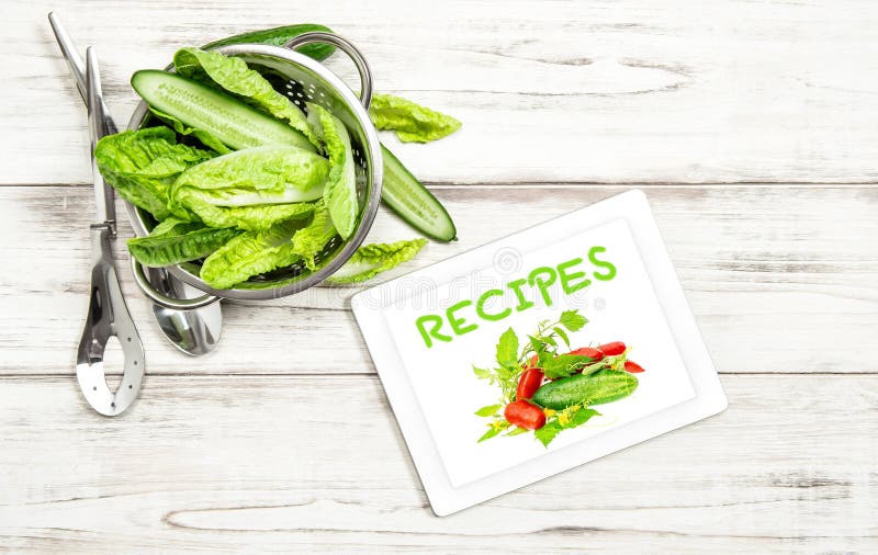 Salad vegetables recipe book tablet pc Internet cook book stock photography Salad vegetables recipe book tablet pc Internet cook book stock photography