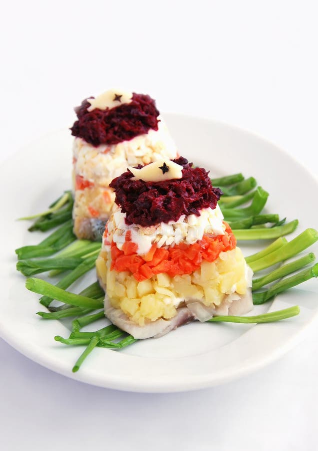 Salada com vegetais e arenques imagem de stock royalty free Salada com vegetais e arenques imagem de stock royalty free