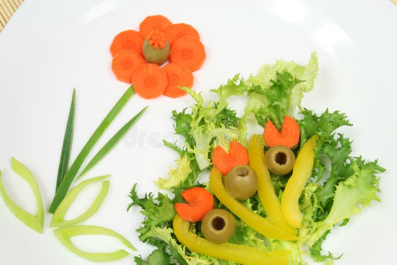 Decorative and colorful salad with lettuce, carrots, olives and peppers. Decorative and colorful salad with lettuce, carrots, olives and peppers.